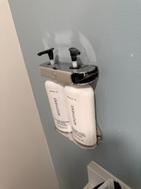 You cannot remove the soap, it is locked into the wall and inaccessible.
