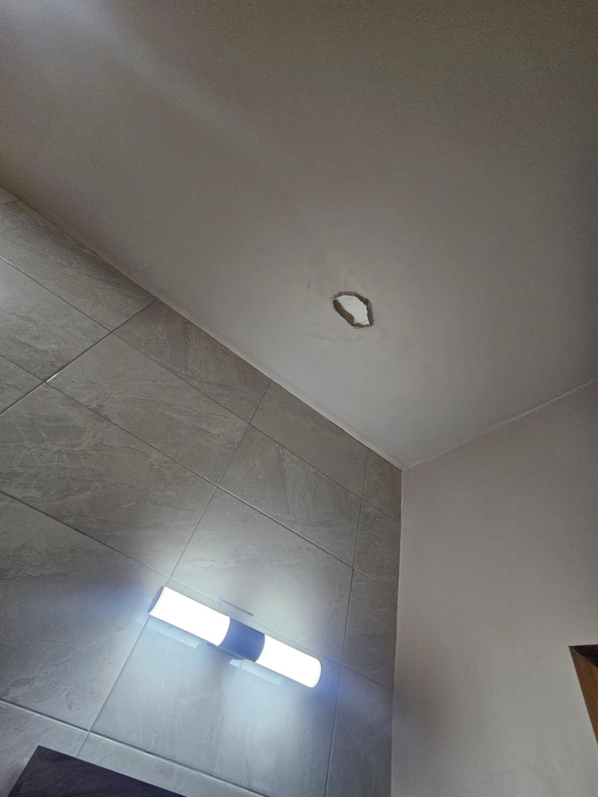 Pieces of the ceiling fallen off with possible water damage.