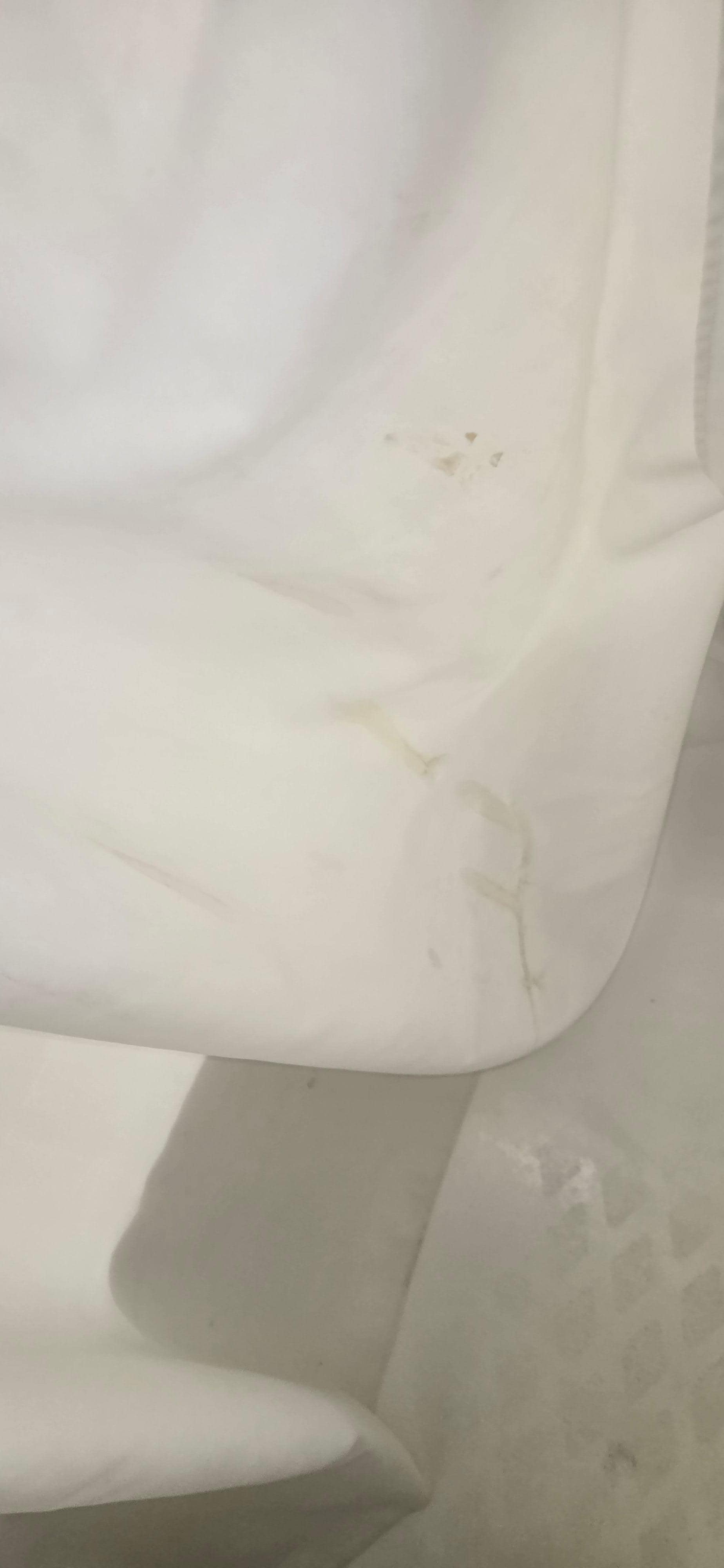 Stained shower curtain.