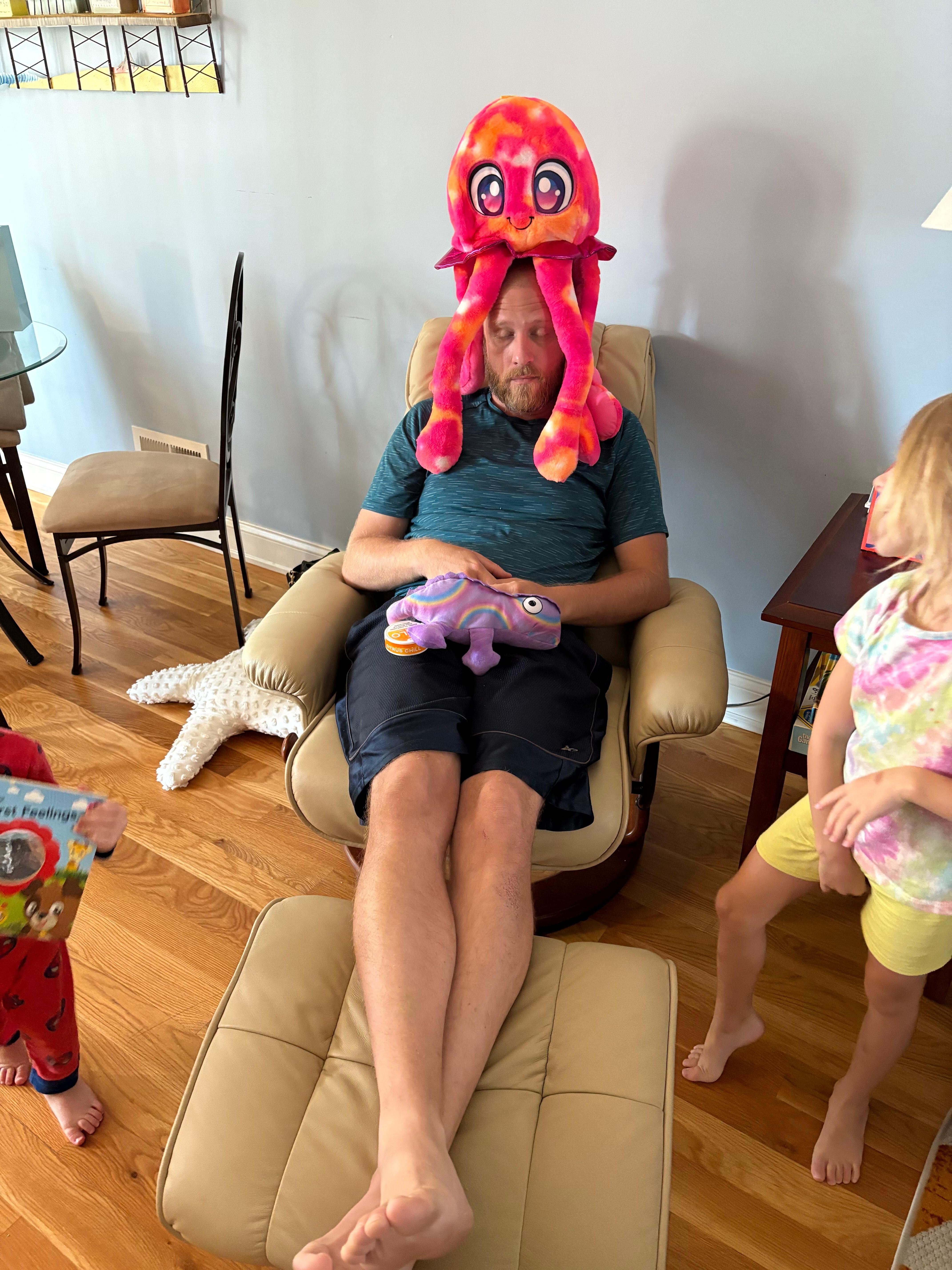 Eric with a jelly fish hate at house in seaside heights NJ with Eliza looking 