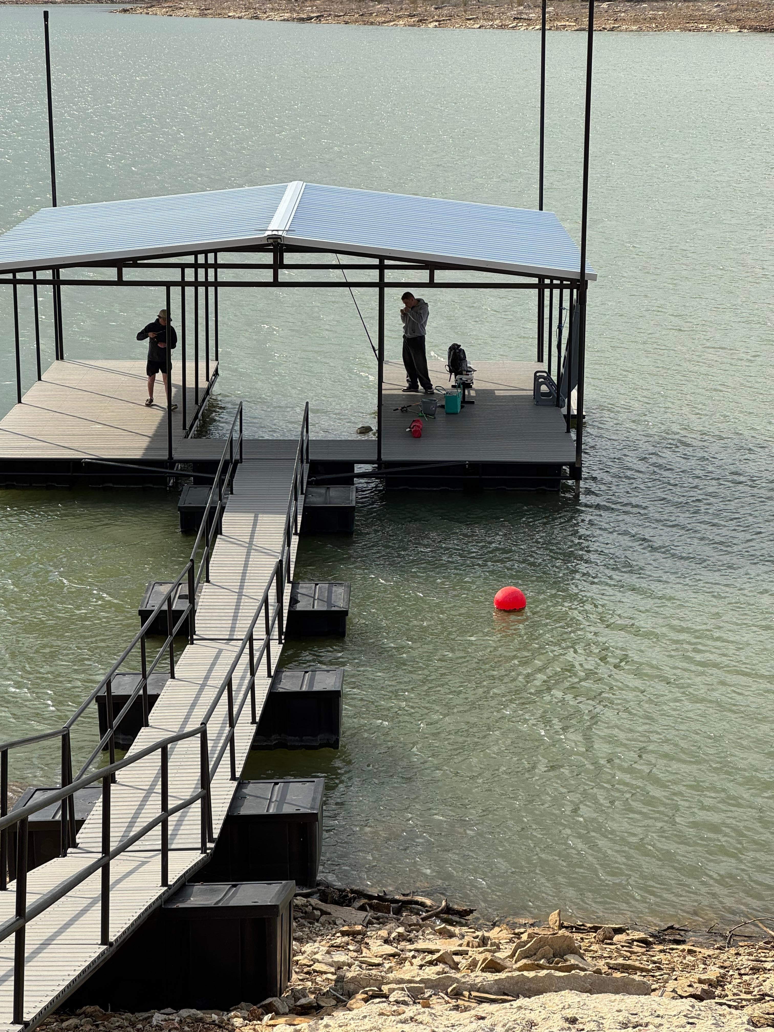 The boys getting set up on the dock. 