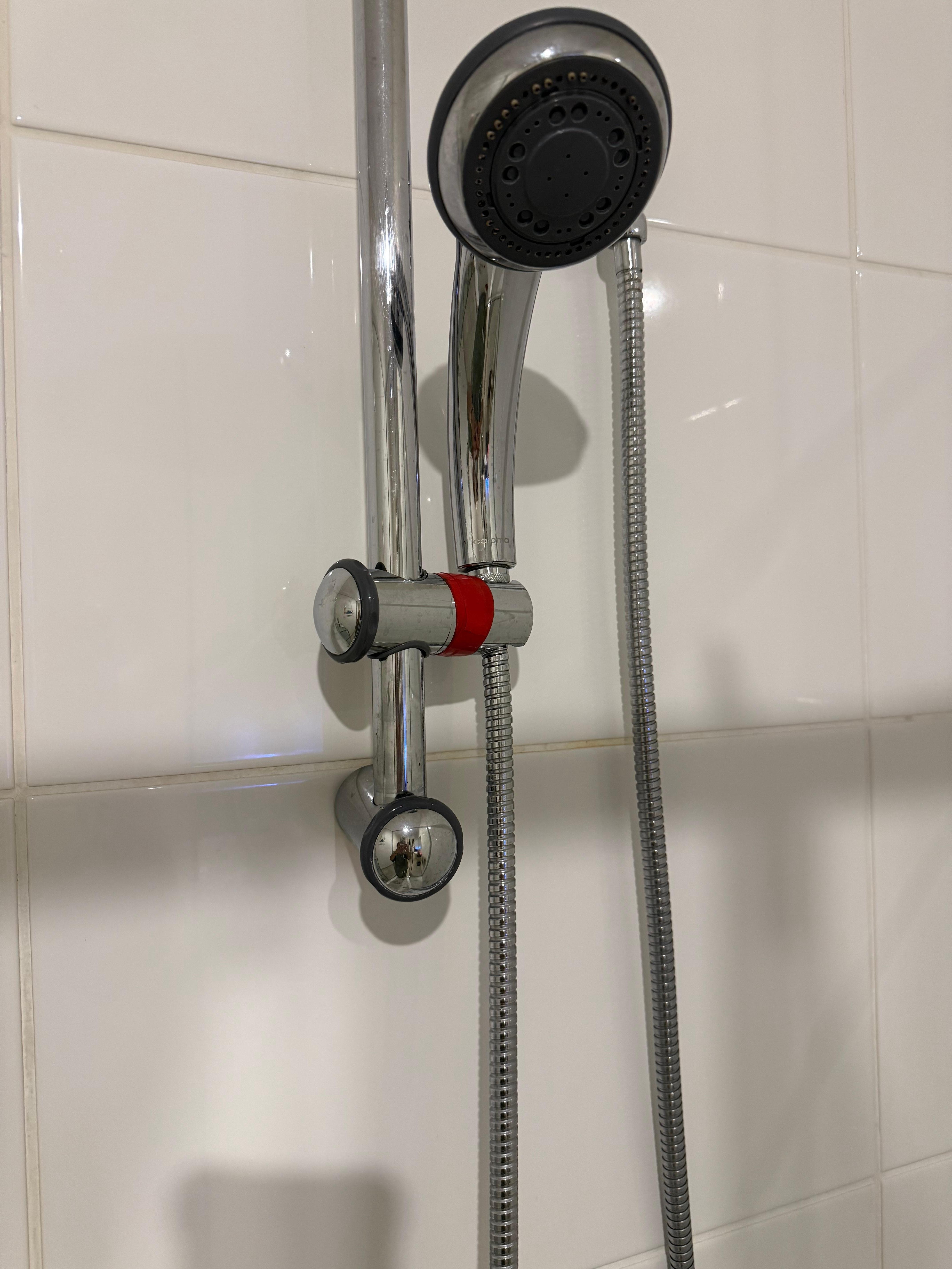 Shower falling apart & held up with duct tape