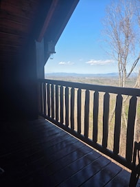 View from top deck sitting on porch swing.