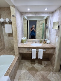 Bathroom with separate area for toilet.