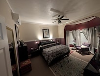 Upstairs bedroom with relaxing lighting and huge windows.