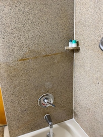 Rust stain on shower wall