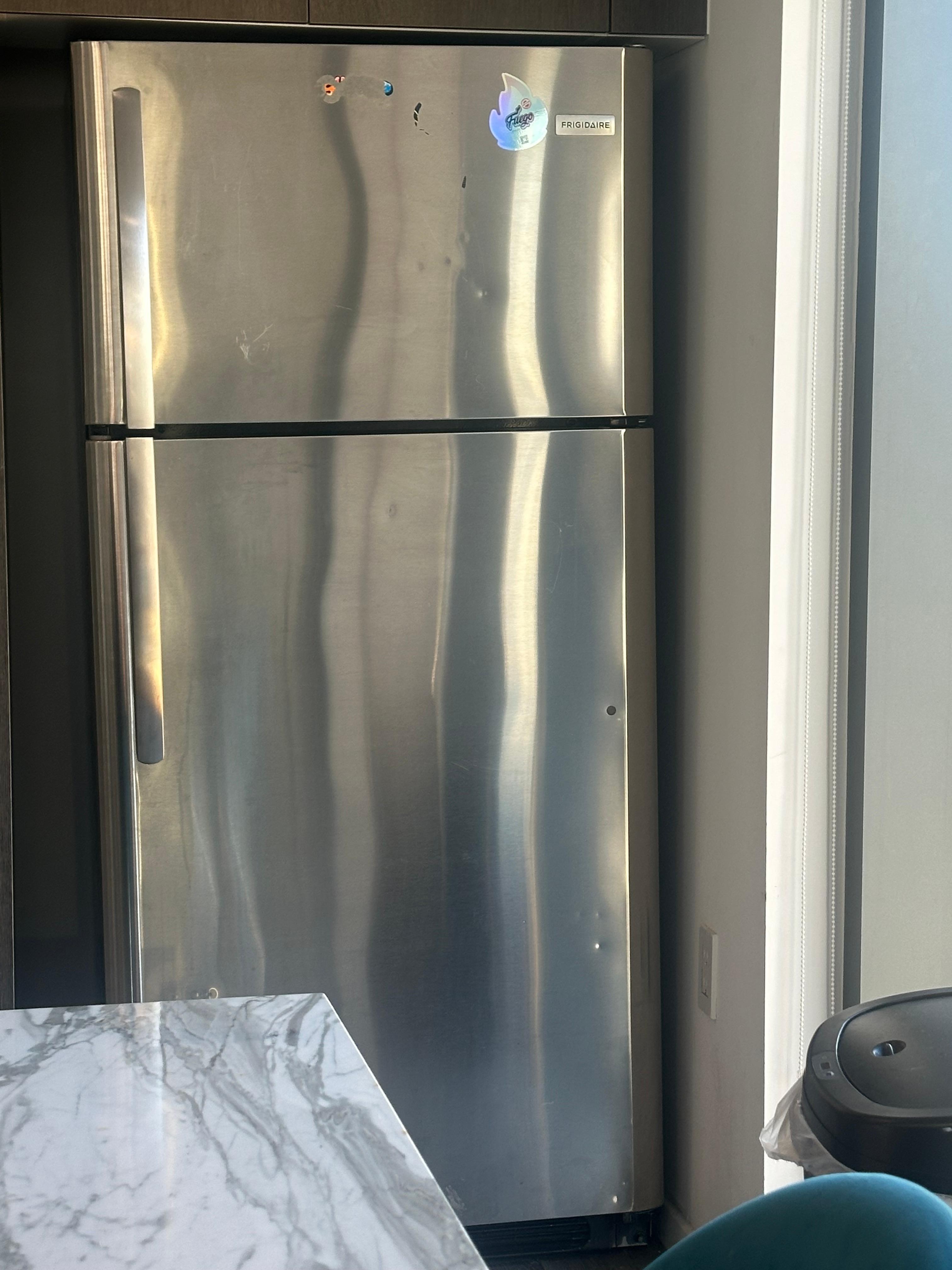 Beat up refrigerator 