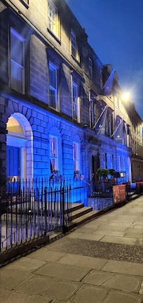 The entrance, beautifully lit up at night.