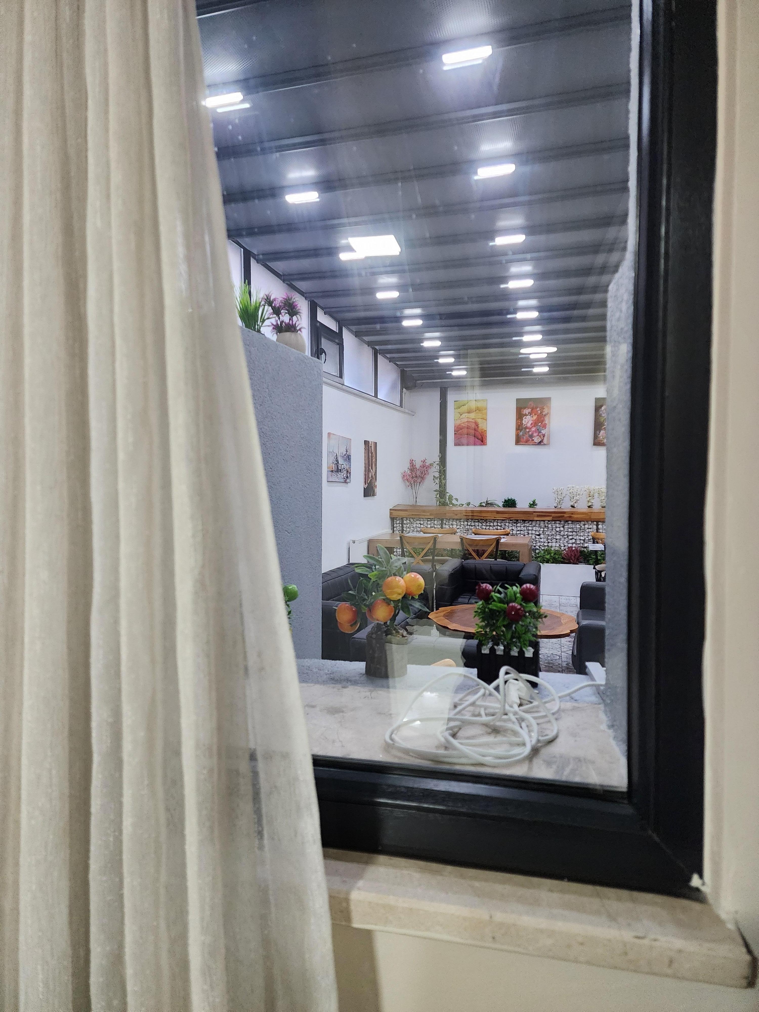 The window in my room was looking into so-called "dining room", which actually was enclosed back patio. No heat. Cold noisy area.  