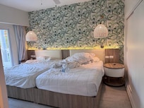 Two beds, no space between or around them