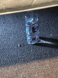 So clean a bottle of 80proof liquor was under the bed