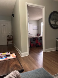View into queen bedroom from living room