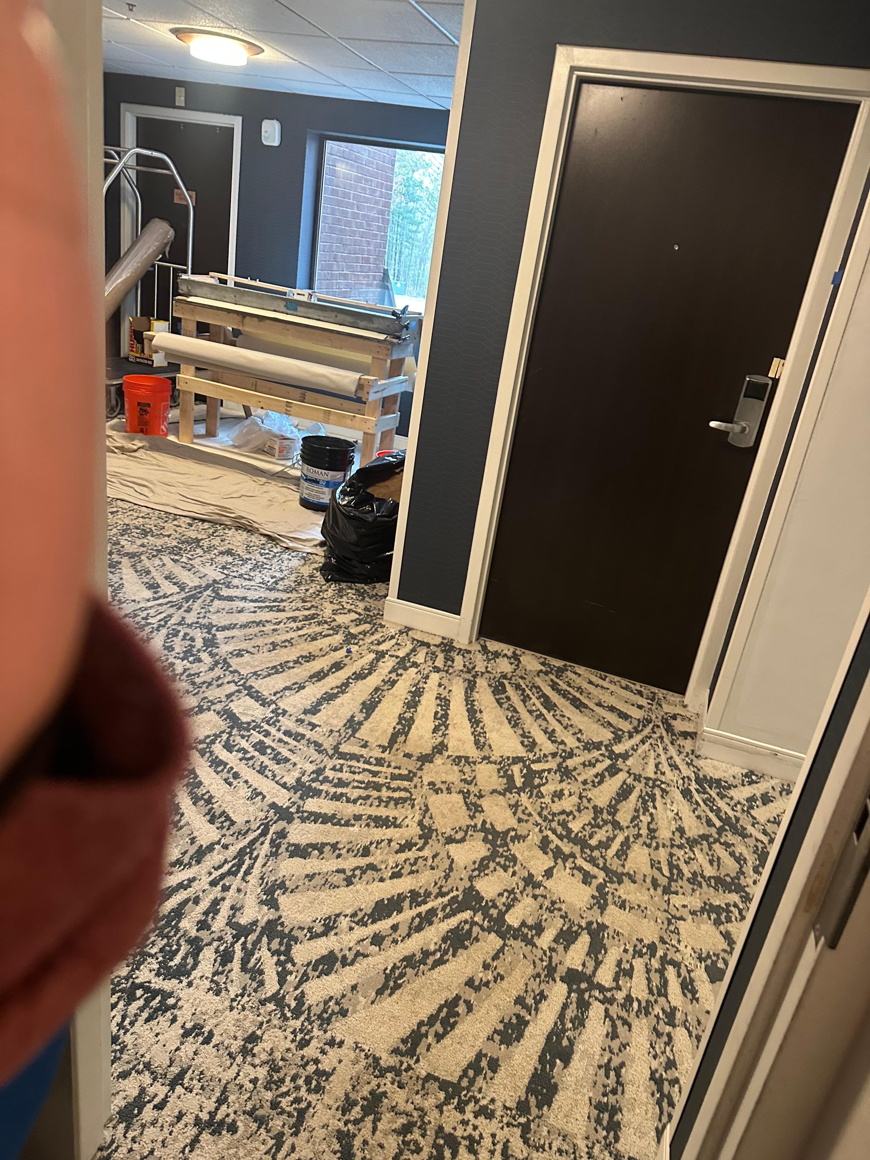 right in front of room door 