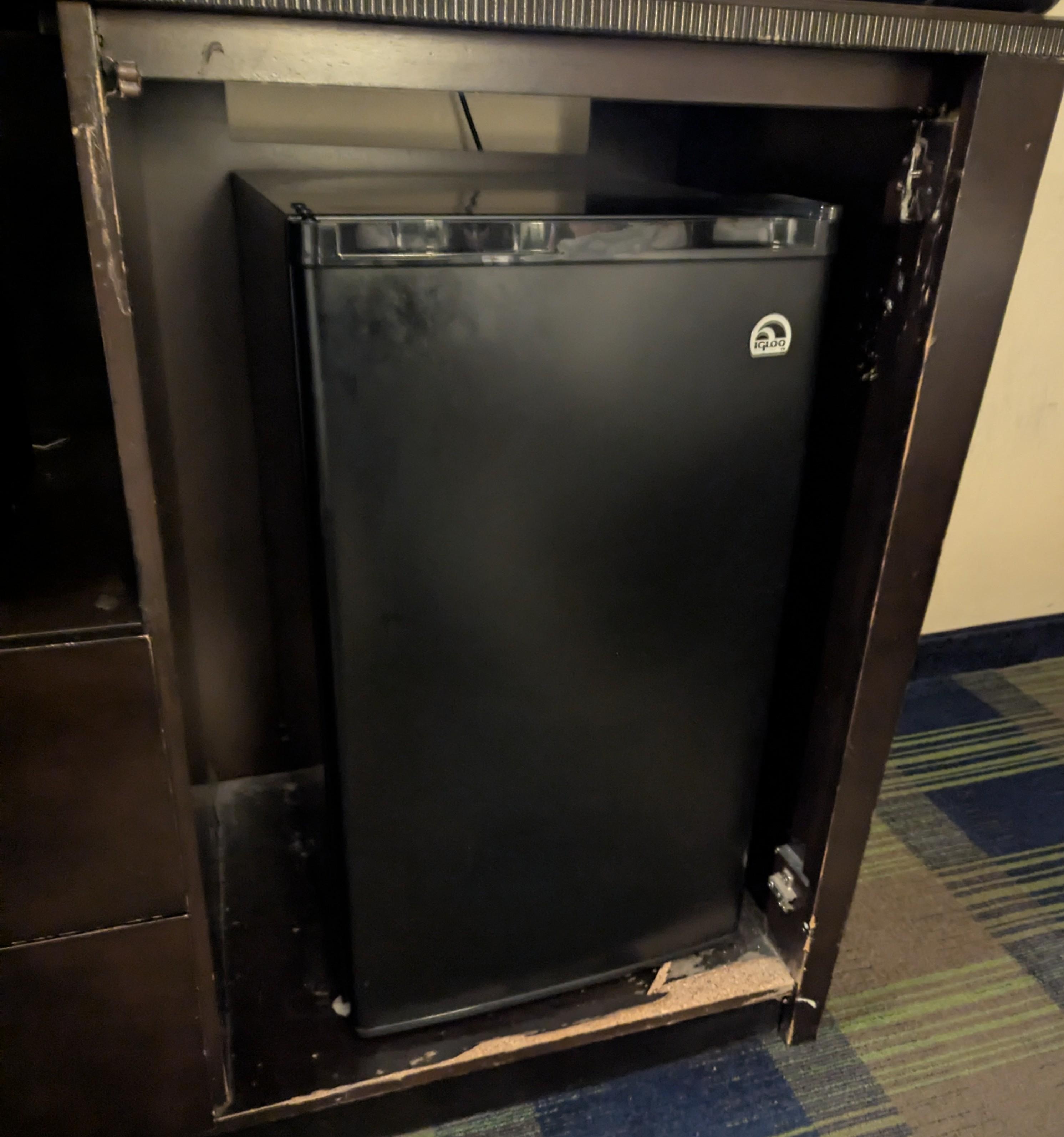 Door ripped off dresser where fridge was stored.