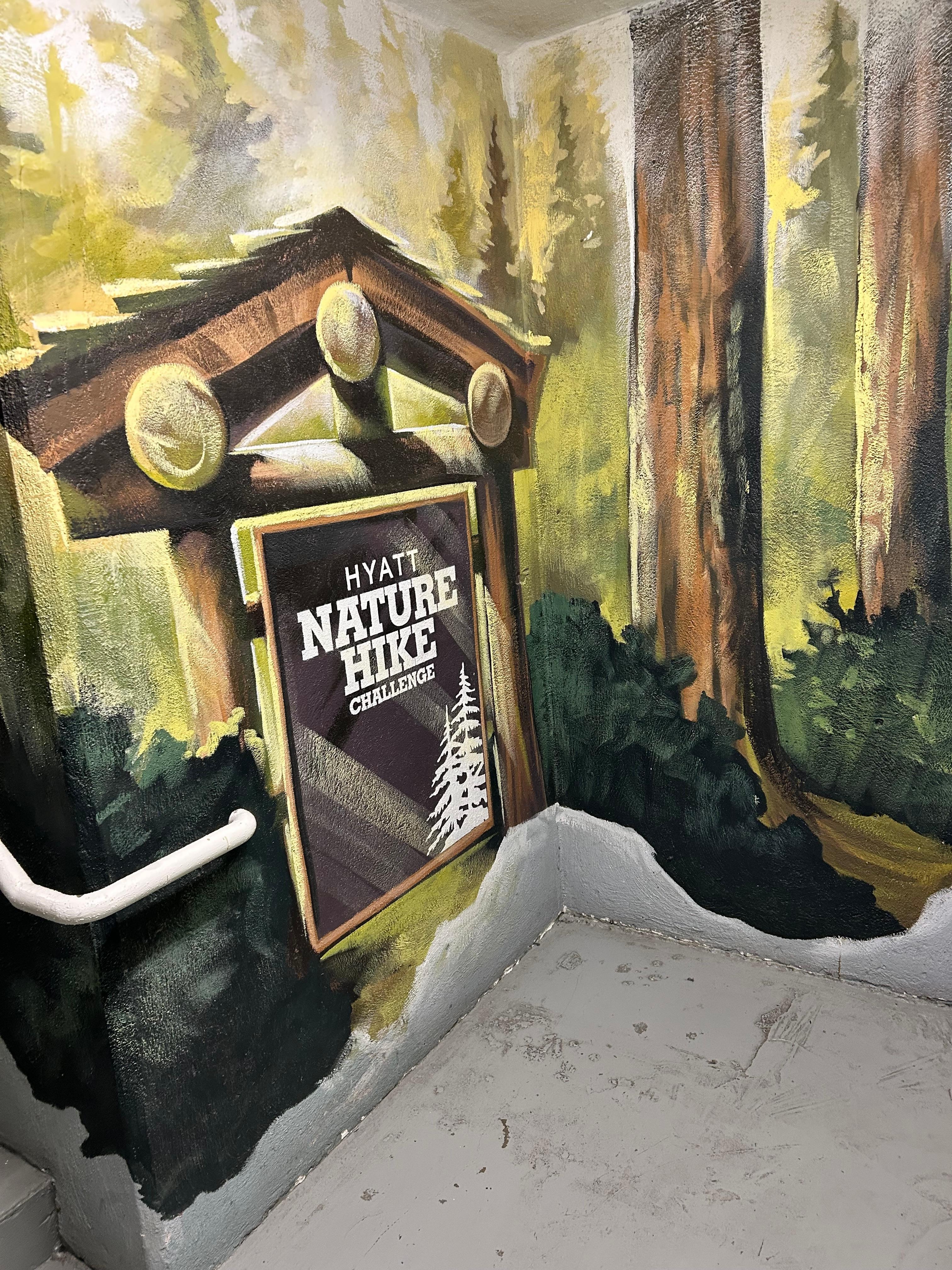This is a photo at the beginning of the nature hike in the stairwell really cool idea they hired an artist to add this extra element