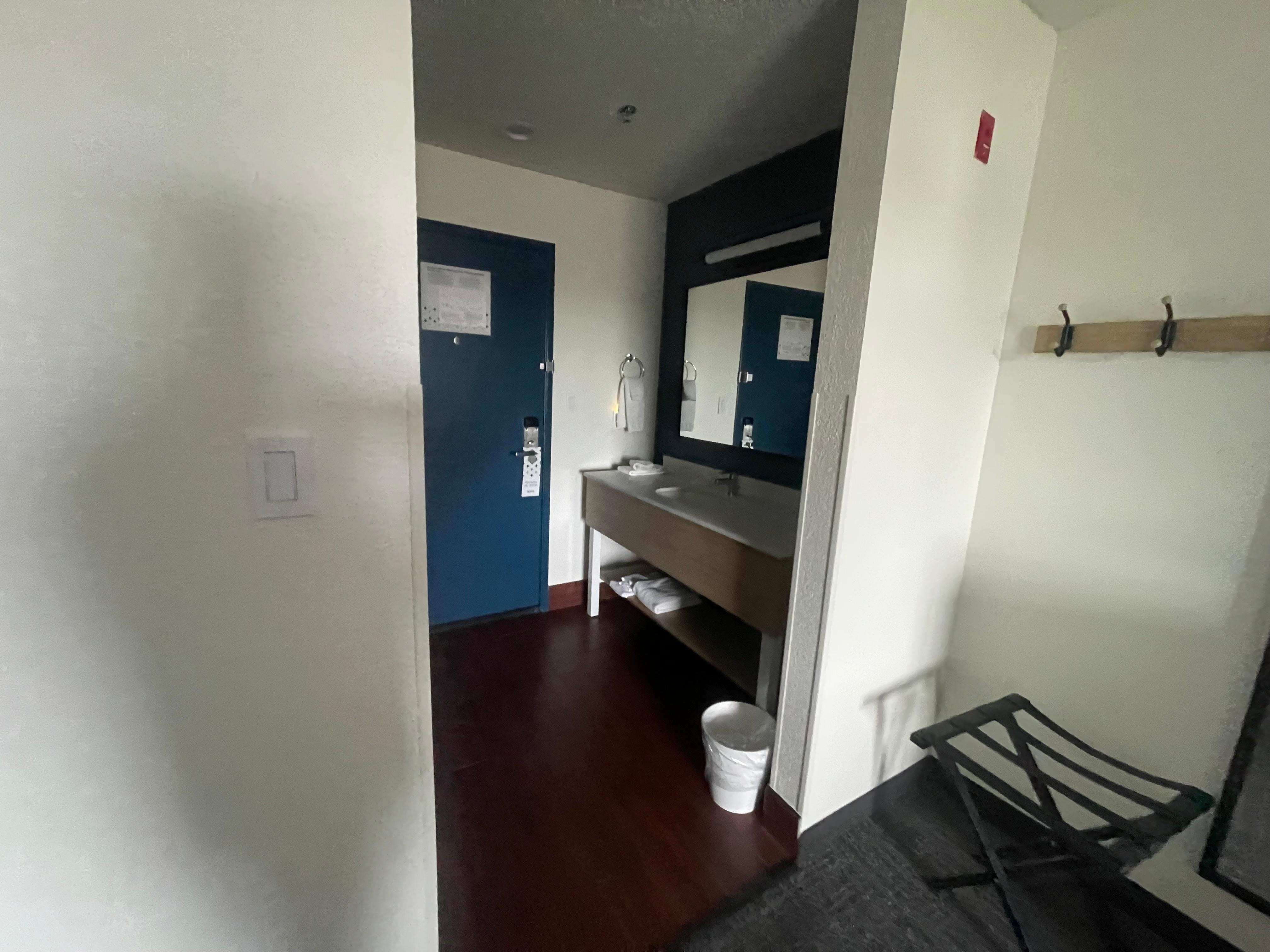 Bathroom sink by the door. 