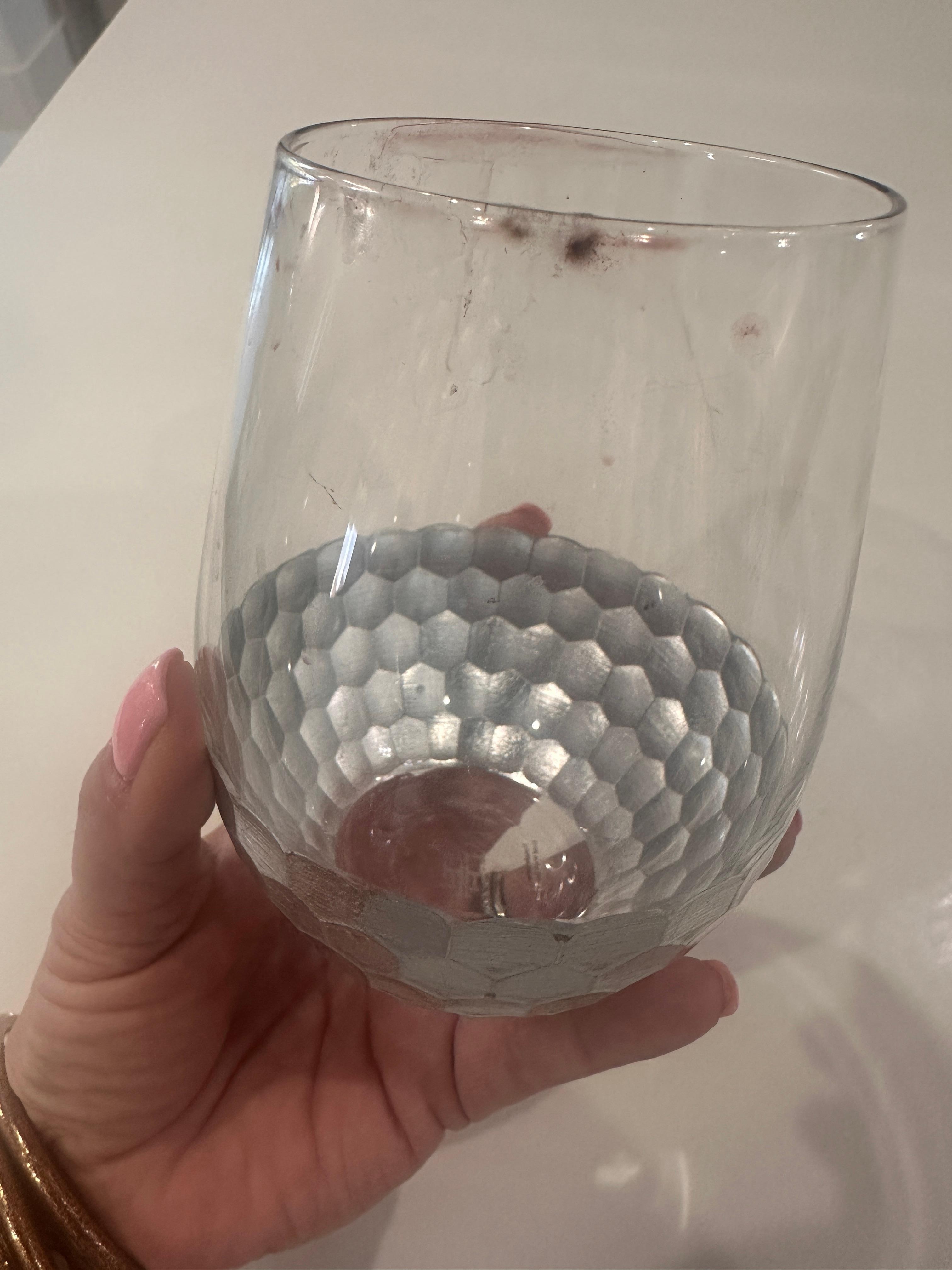 Dirty glasses in cabinet 