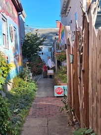 You come in off of commercial street through an alley of art to the place. That's why it is quiet yet in the action.