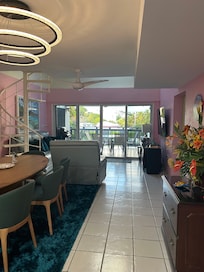 Large dining table and new leather couches in the living room.