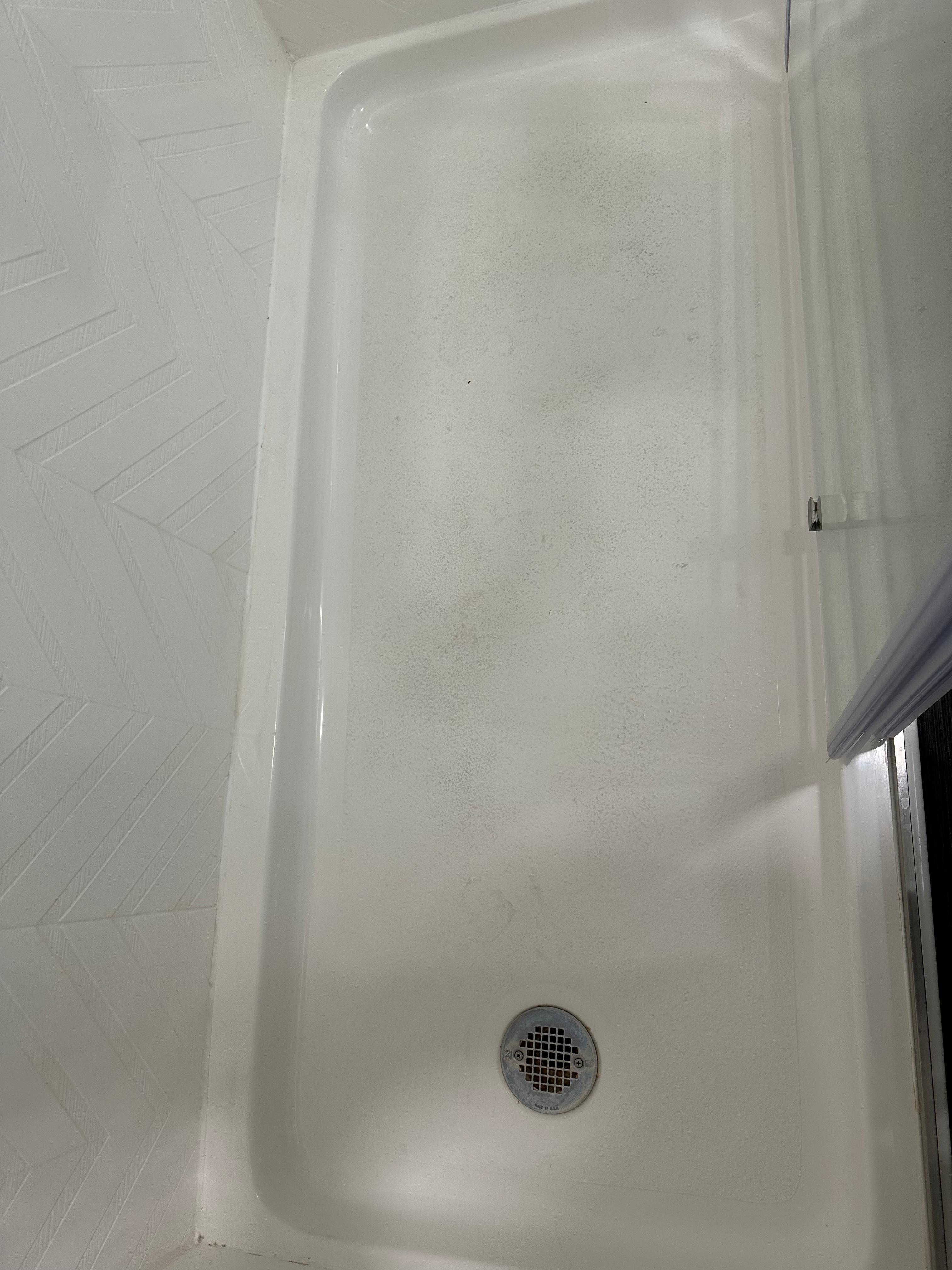 Dirt and bedded in floor of shower