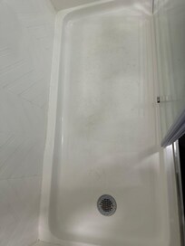 Dirt and bedded in floor of shower