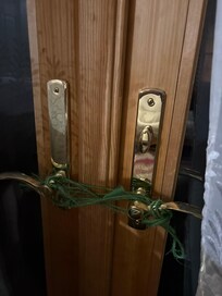Door to outside tied shut