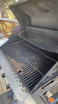 grill covered in food residue and grease.