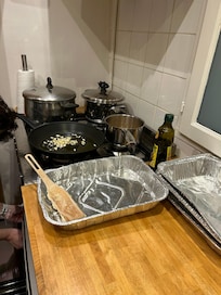 Lots of pots and pans available in the kitchen