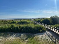 Boardwalk to beach right outside of condo!