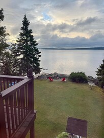 View from the kitchen window. Daddy/daughter floating in the lake.