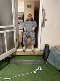 Wheelchair in Game Room doorway, on the way to the back door to let the dog out