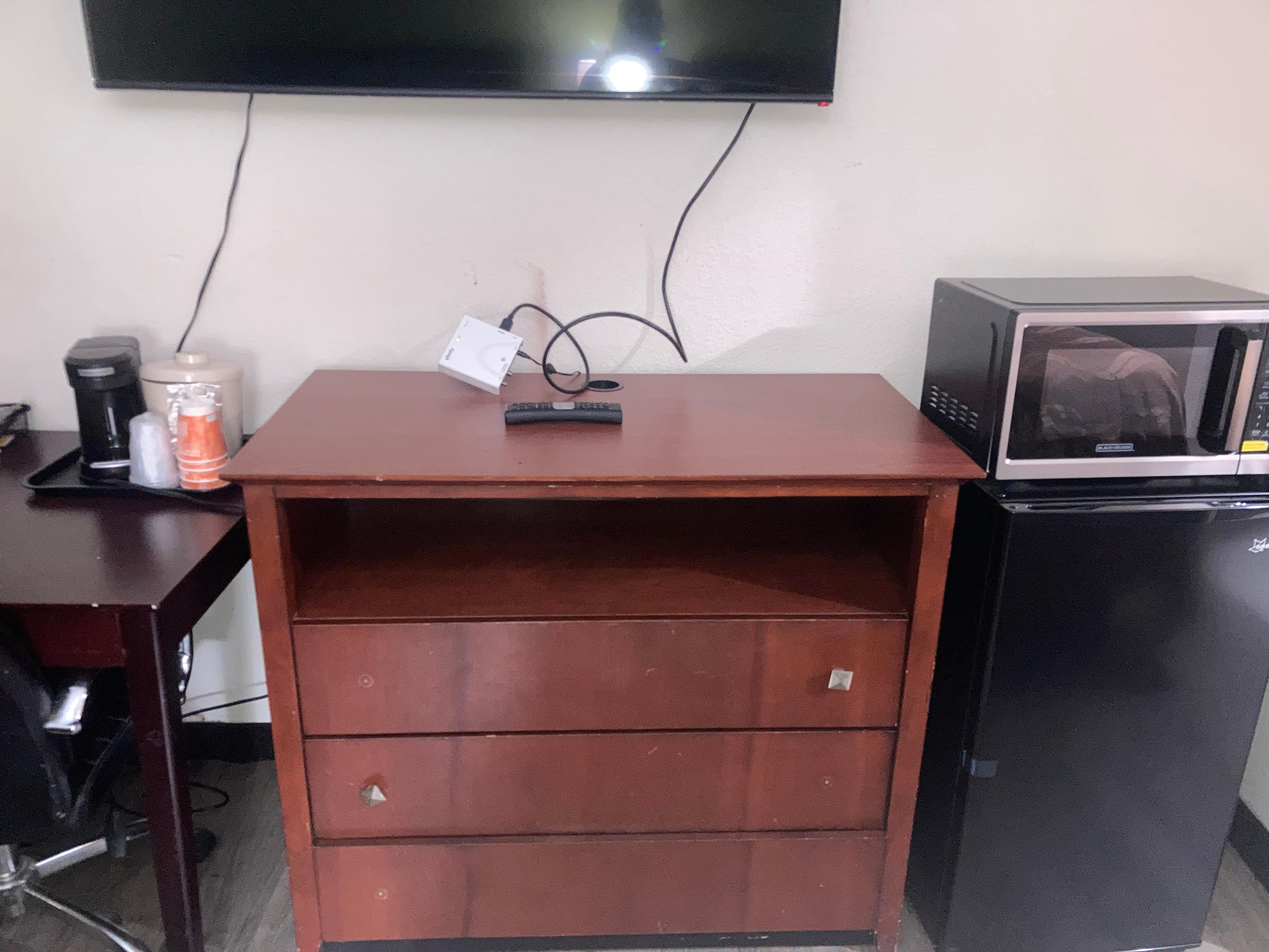 Missing hardware, dinged up, cable box just hanging there