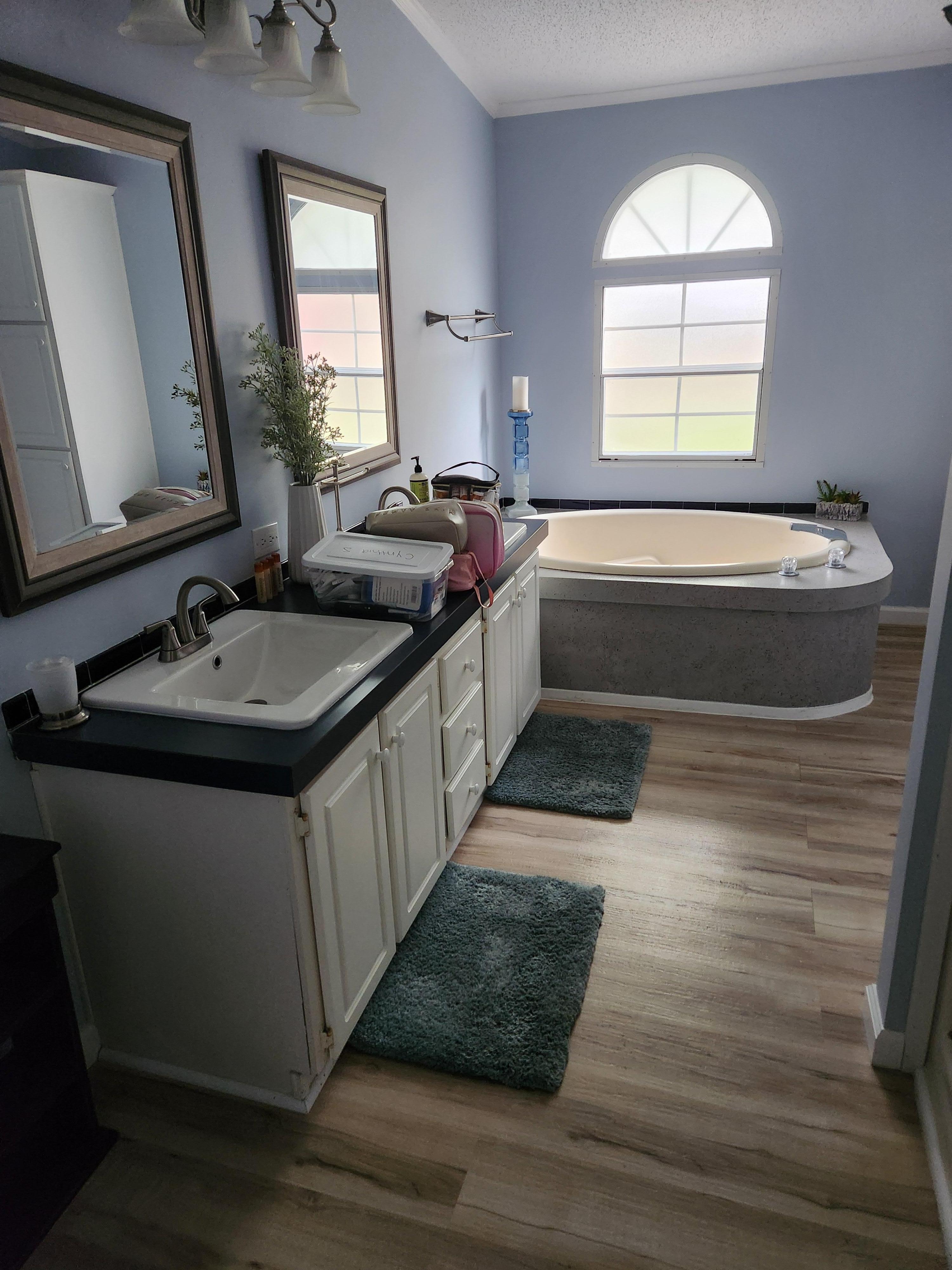 Master bedroome with tub and standalone shower.