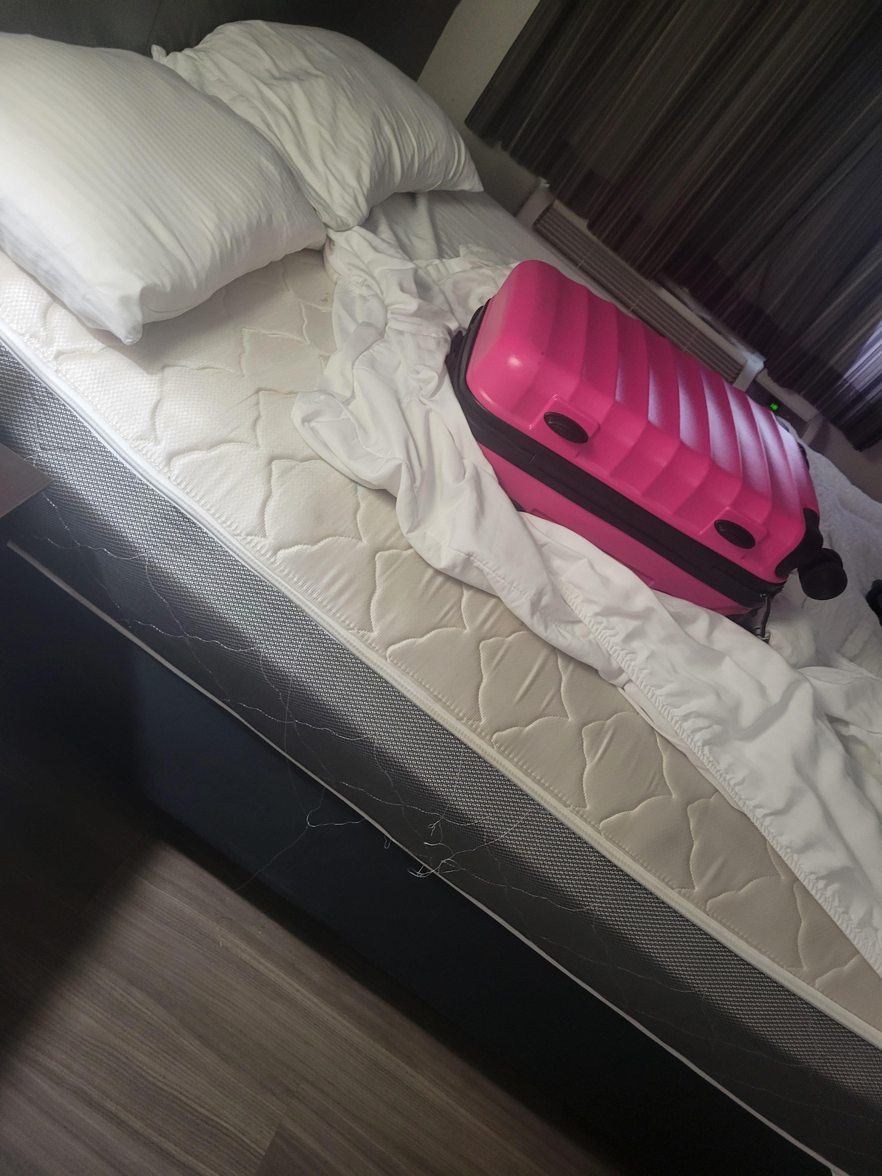 Broken bed and flat old pillows