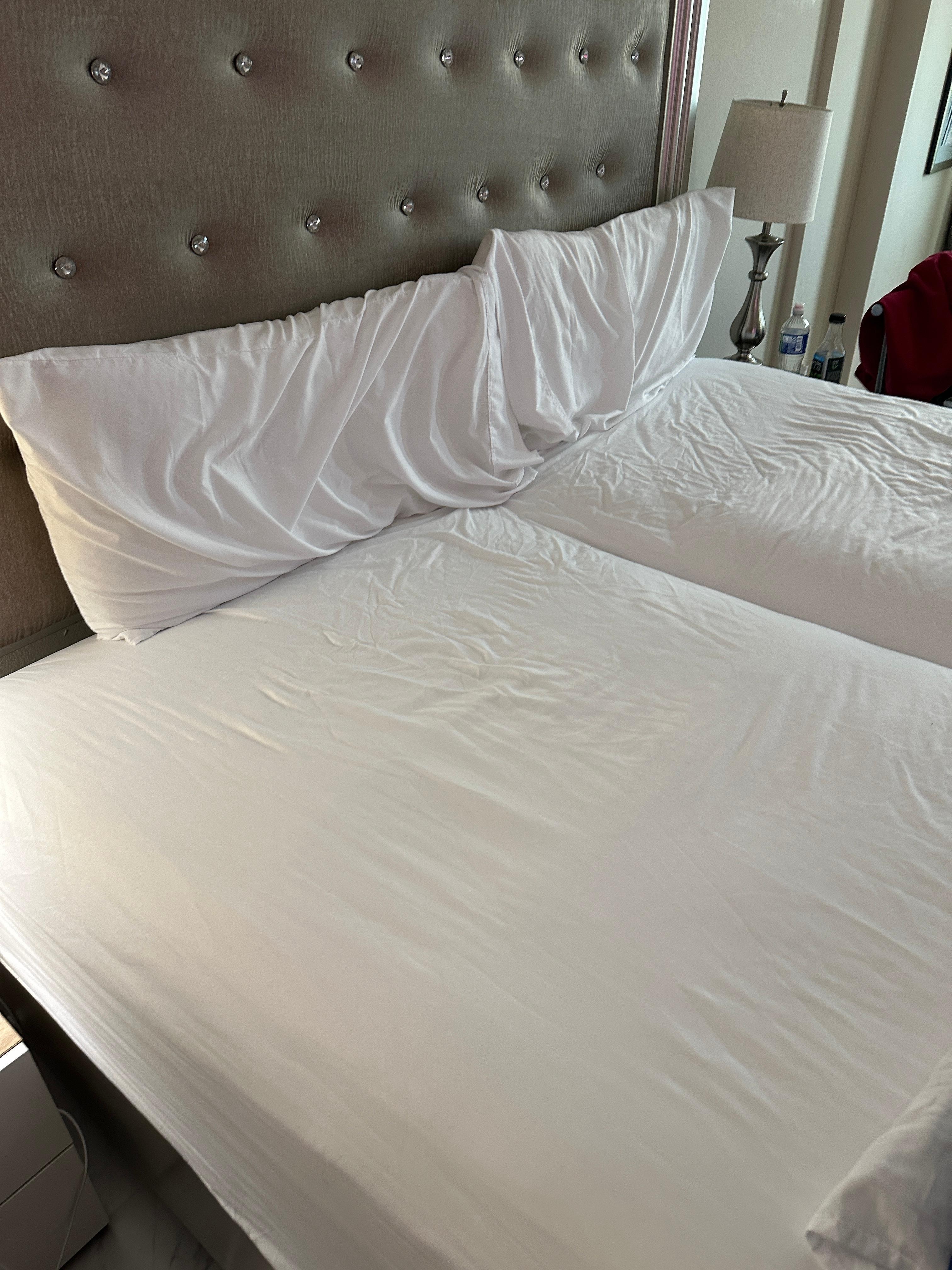 The mattress was extremely uncomfortable, and I woke up with back pain. The bed consisted of two twin mattresses pushed together, and I woke up with my knee in the gap between them. There were only two very thin pillows provided. The only addition