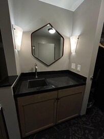 Counter/sink area in room.