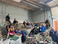 Our group along with several artists at the Net Your Problem warehouse.