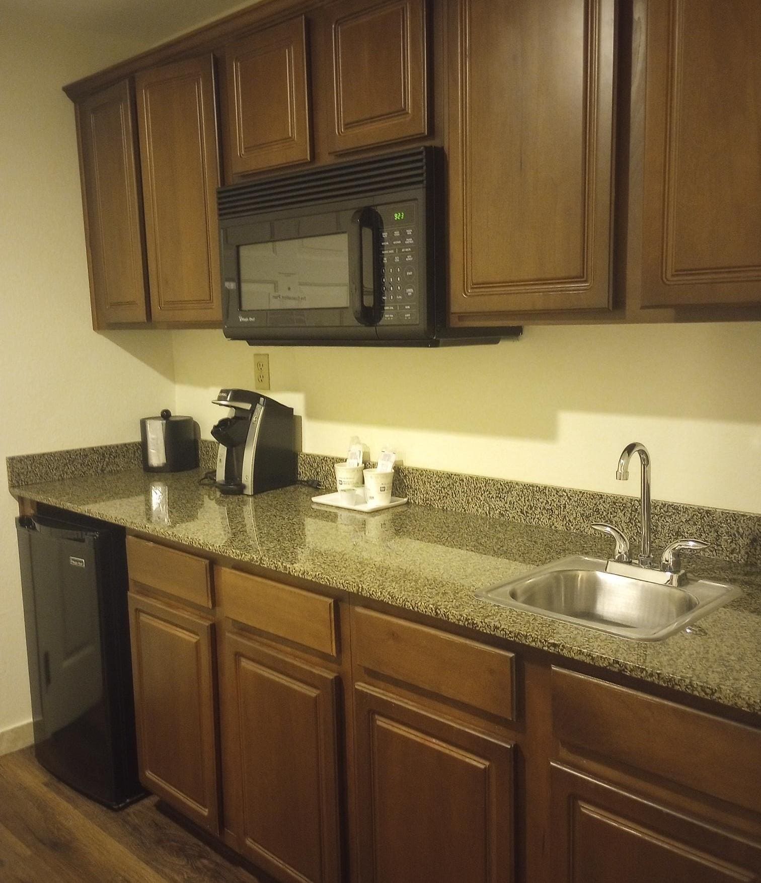 Lots of space to prepare your takeout food or microwave leftovers. The cupboards and drawers were empty.