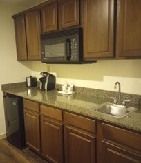 Lots of space to prepare your takeout food or microwave leftovers. The cupboards and drawers were empty.