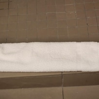 Large hair on shower floor towel