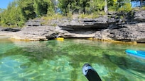 Kayak or bike to nearby Cave Point.