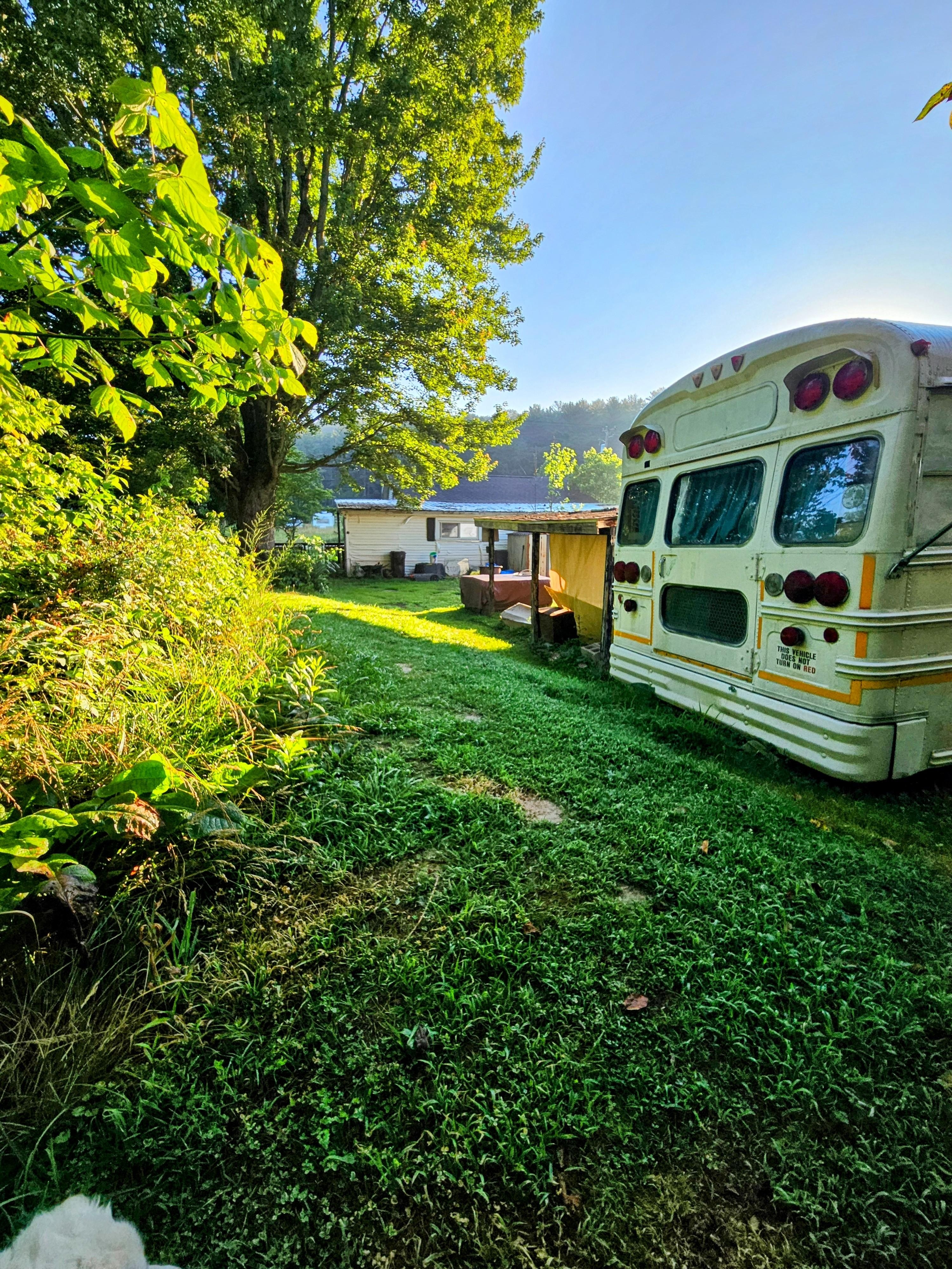Bus is directly behind a house