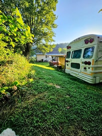 Bus is directly behind a house