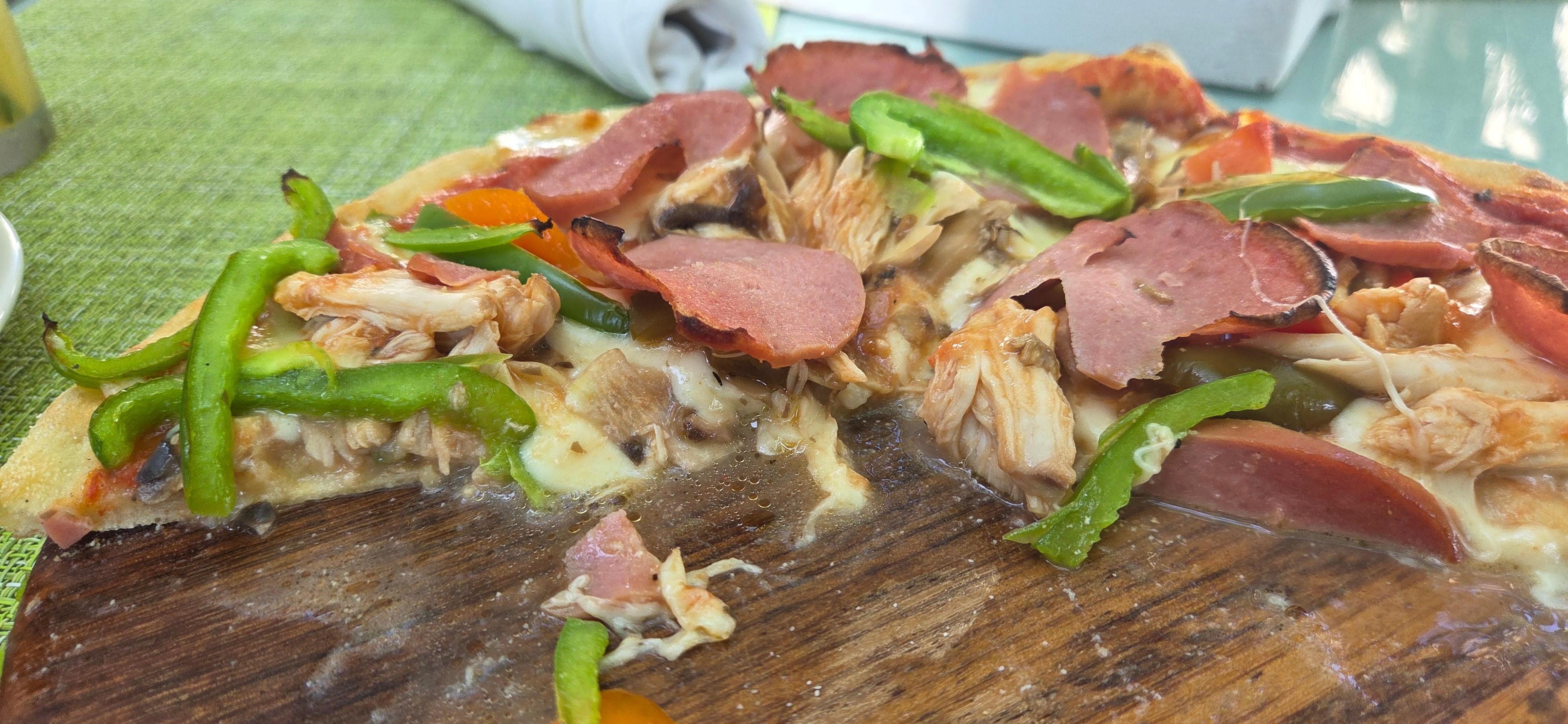 Pizza with some sogginess after waiting for 45+ minutes