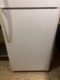 Stains on refrigerator door.