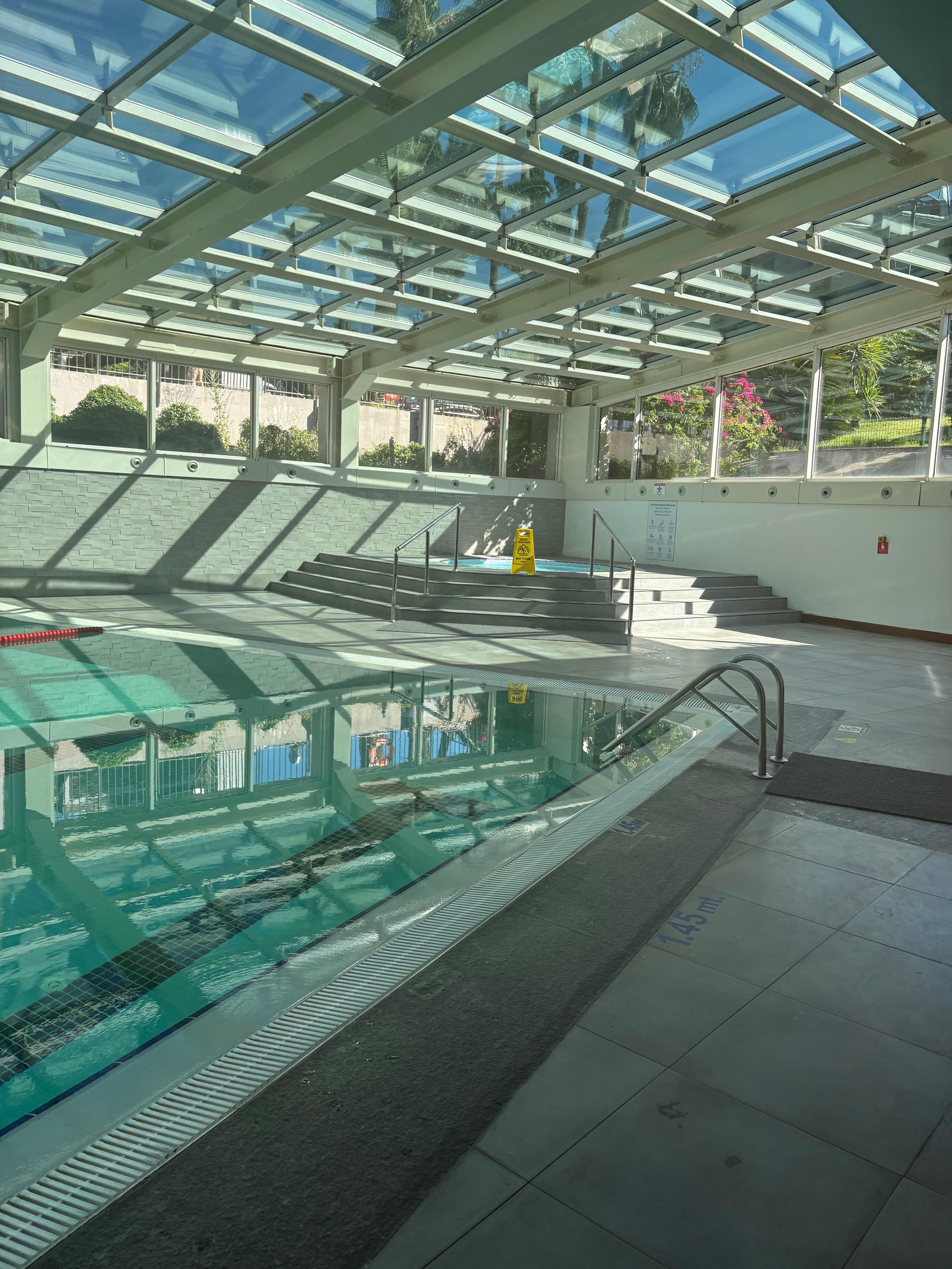Indoor pool next to the fitness center and spa