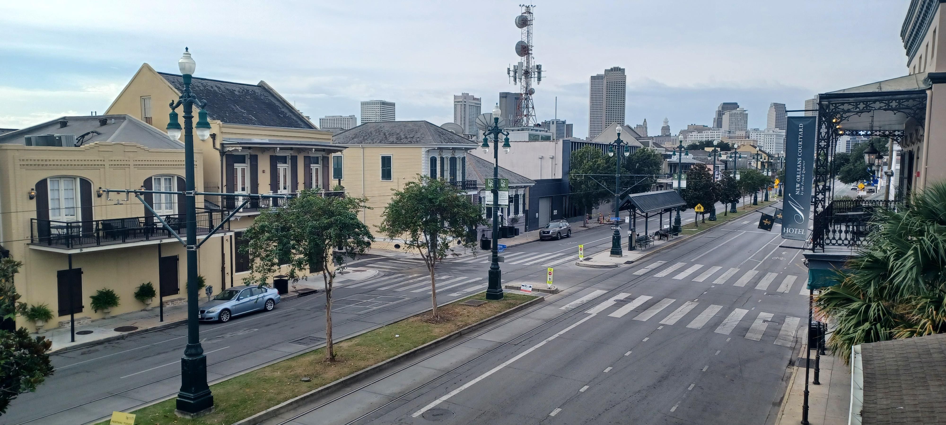 View looking west then east on North Rampart from hotel balcony hallway. Hotel pool courtyard.