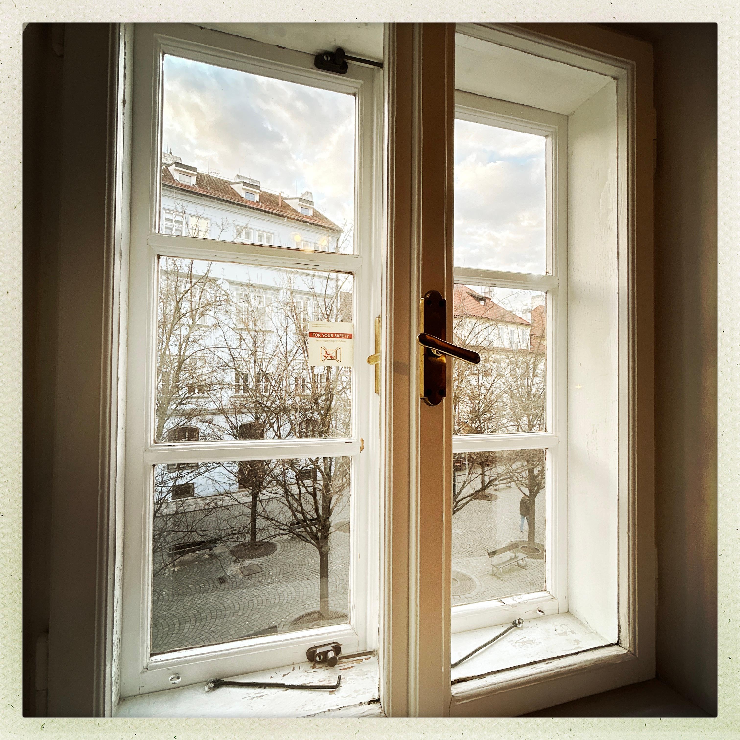 View of Charles bridge at night from back window 