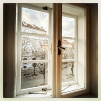 View of Charles bridge at night from back window