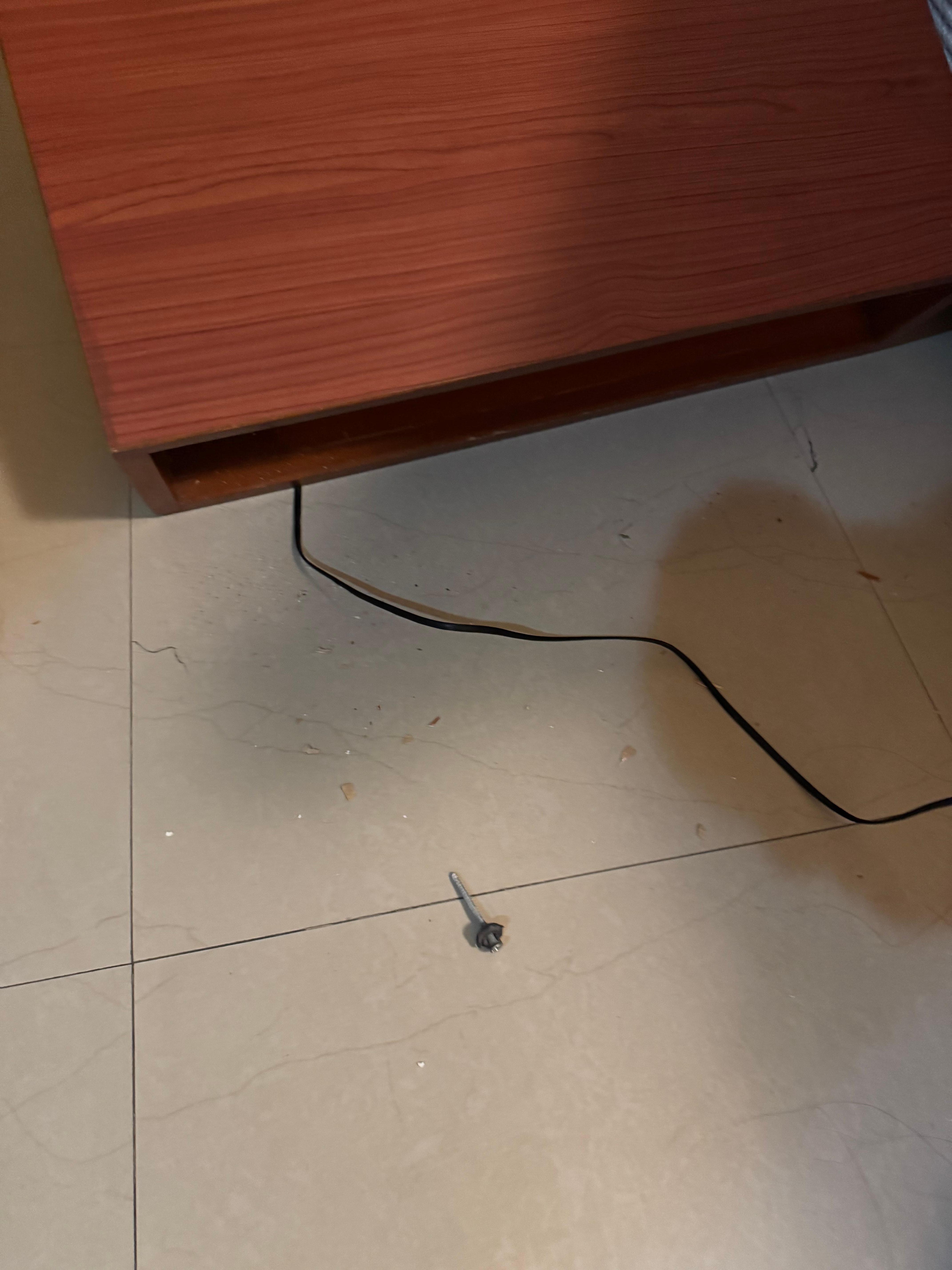 Night stand falling off the wall.